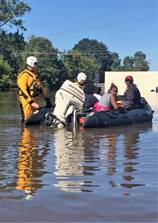 A New Jersey Task Force One Urban Search and Rescue crew evacuates citizens in Lumberton, North Carolina, Oct. 10, 2016. The Lumber River flooded the city after Hurricane Matthew. (U.S. Coast Guard photo by Petty Officer 1st Class James Prosser/Released)