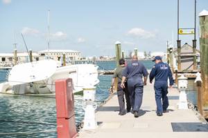Coast Guard responders inspect and asses a marina for damage and pollution Sept. 15, 2017 in Key West, Florida. 