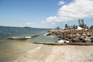 Agents from Coast Guard Investigative Service inspect aground sailboats and debris Sept. 15, 2017 at the Trumbo Point Annex for Naval Air Station Key West.