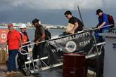Federal employees depart the Coast Guard Cutter Yellowfin in San Juan, Puerto Rico to prepare for reconstitution and recovery efforts in the U.S. Virgin Islands due to Hurricane Maria, Sunday, Sept. 17, 2017. 