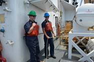 Seaman Brandon Gannon instructs embedded media reporter Blair Miller on line handling, Wednesday, Oct. 10, 2017. Coast Guard cutter Active has a crew complement of about 75. (U.S. Coast Guard photo by Petty Officer 3rd Class Nicole J. Groll) 